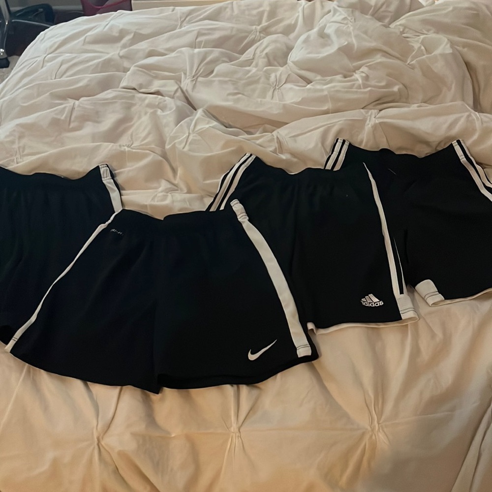 4 black athletic shorts
